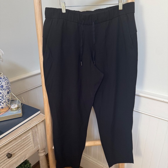 Lululemon Pants - Lululemon On the Fly 7/8 Pant Black Luxtreme Jogger Women Size 12 LW5BPMS